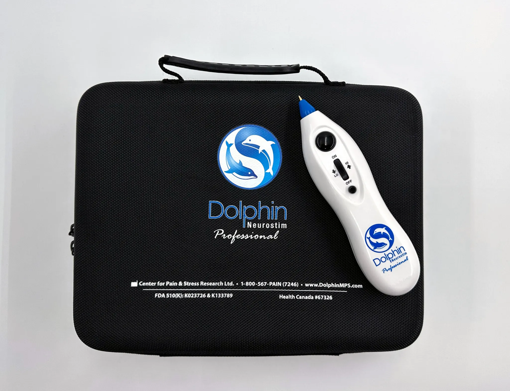 Dolphin Neurostim device sitting on top of travel case.